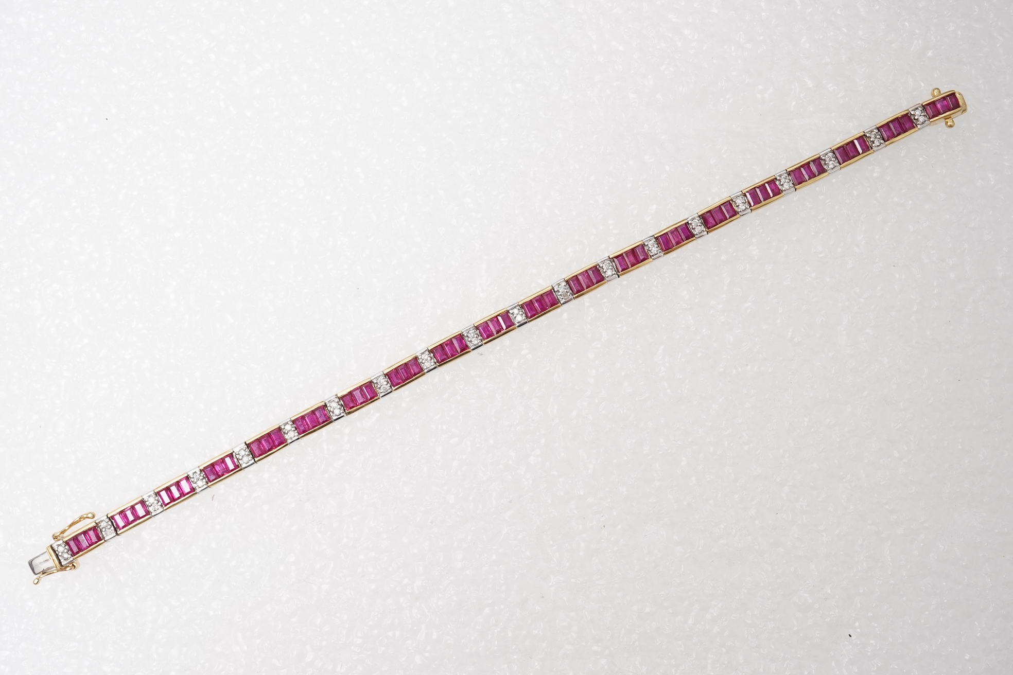 A ruby and diamond bracelet and pendant